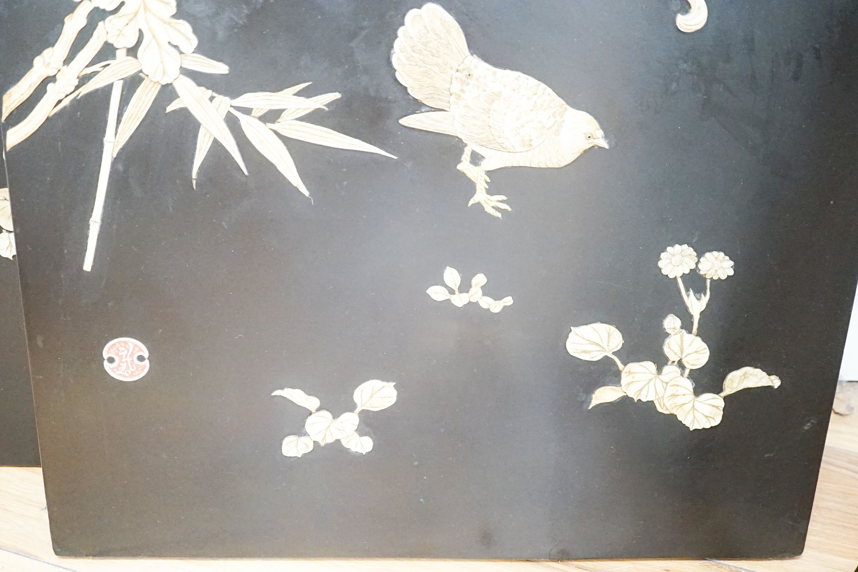 A pair of late 19th century Japanese bone and mother of pearl inlaid shibayama style panels of birds amid flowers, 91 x 51cm